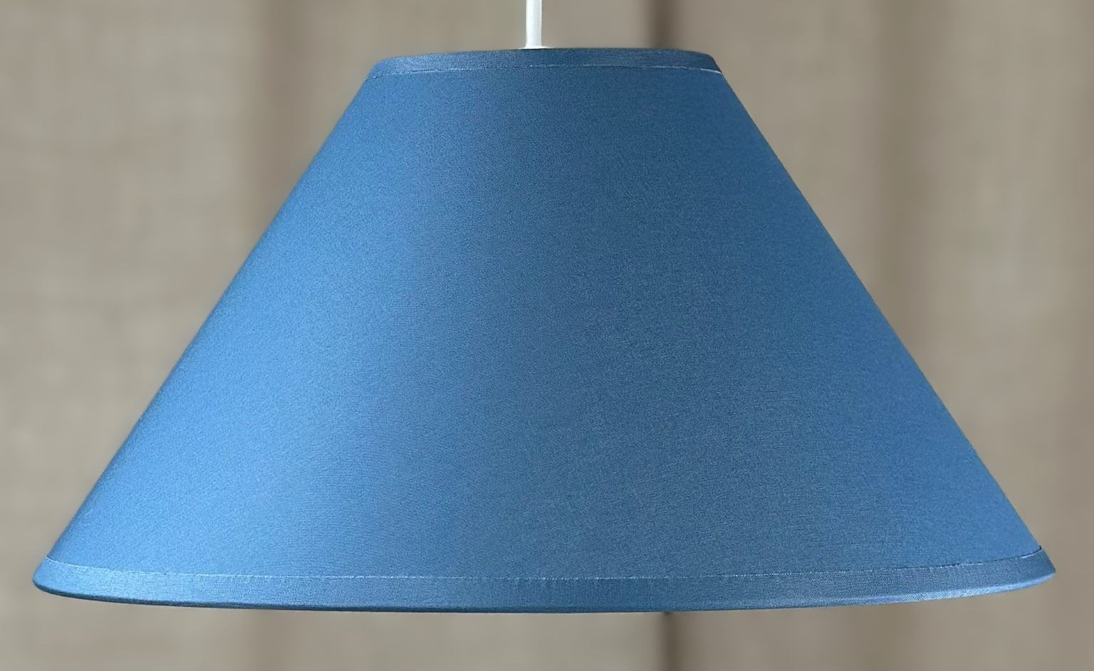 Modern and stylish Lampshade - Coolie - Small - in Cadet Blue with a taped edge and white lining. Ideal for any room. Made to order lampshades