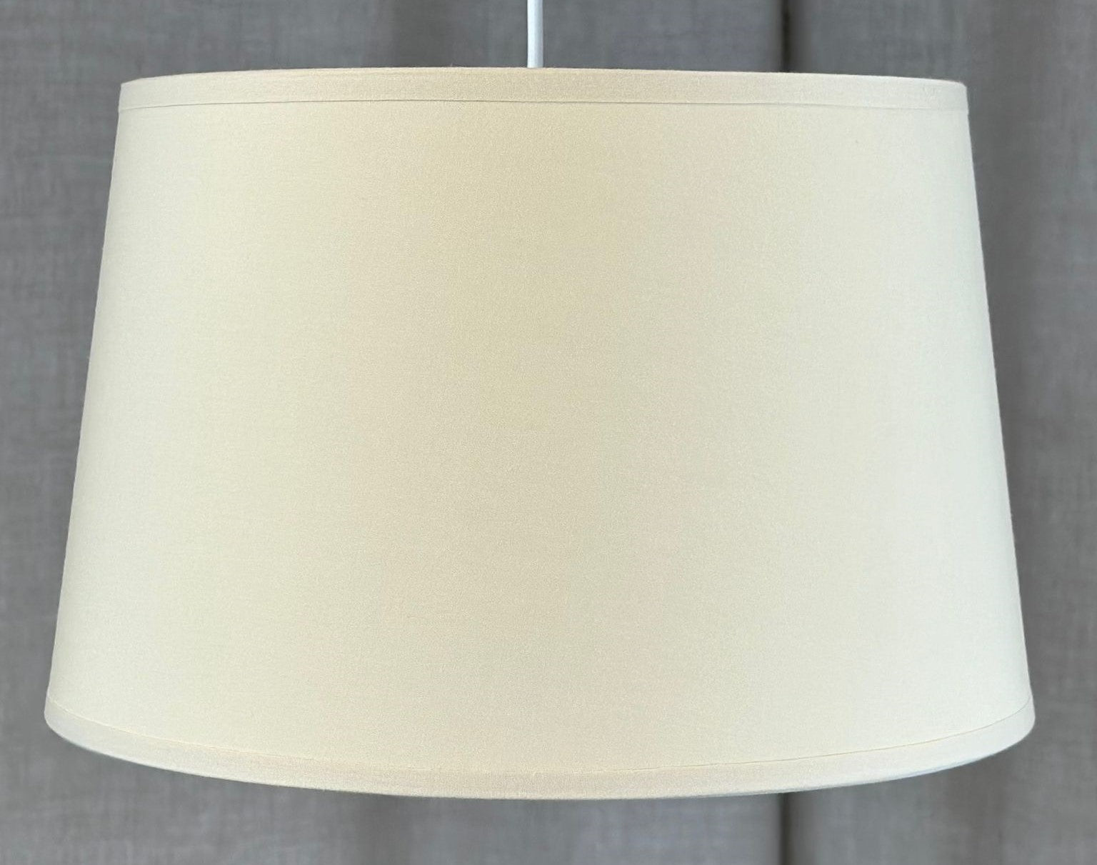 Modern and stylish Lampshade - French Drum - small - in Biscuit with a taped edge and white lining. Ideal for any room. Made to order lampshades.